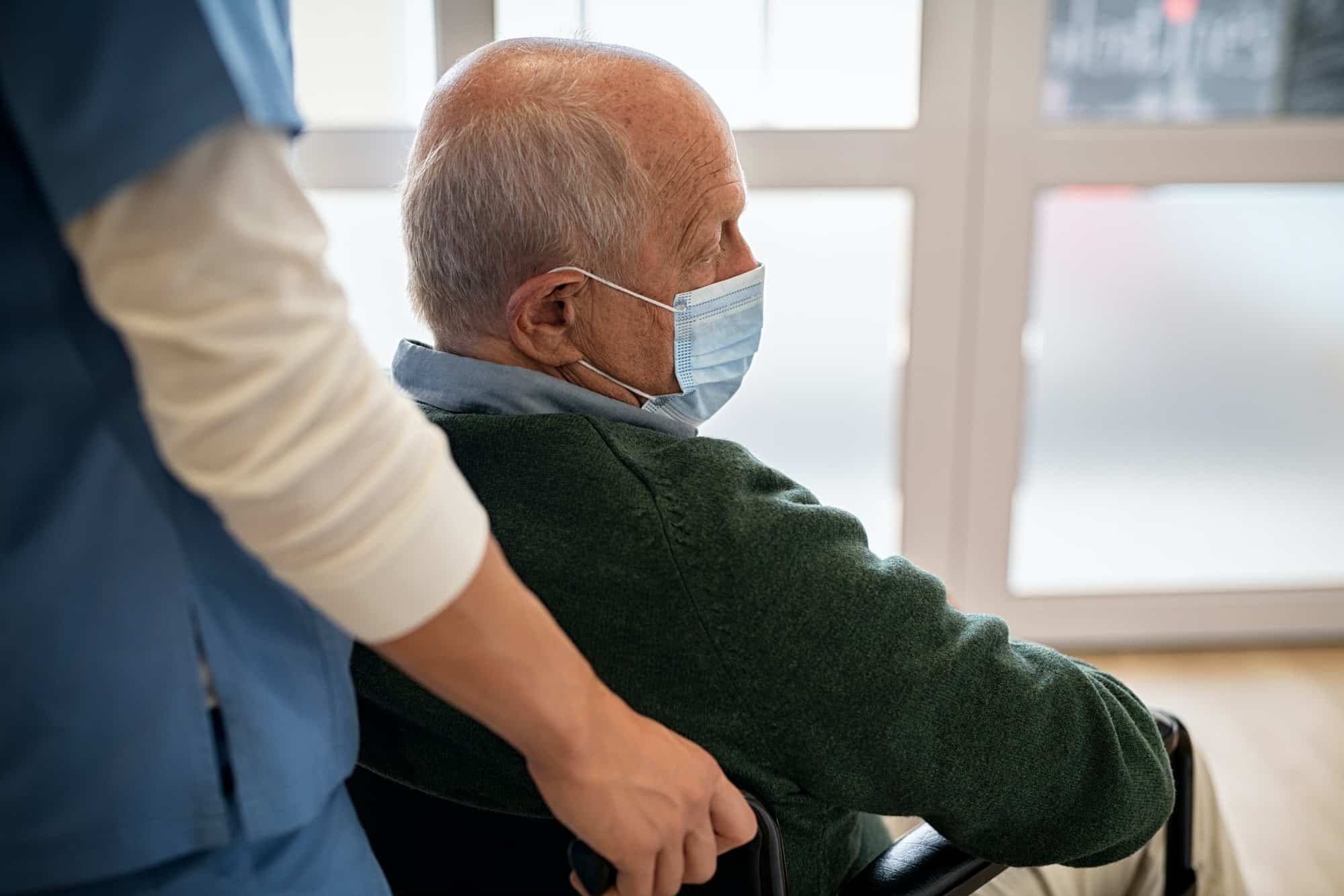 Senior man in wheelchair at nursing home